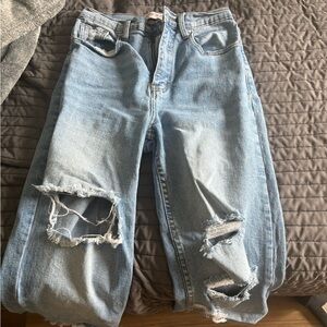Light wash straight leg ripped jeans